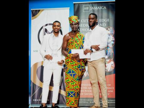 Remone Watson, winner of the Mr World Jamaica talent fast-track competition, shares the frame with first runner-up Rajesh McLean and second runner-up Tavar Brown.