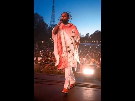 Popcaan walks on stage at the Crystal Palace Bowl.