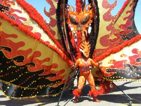 In this file photo, Rebecca Kerr is seen as The Fire Dancer at the 40th anniversary of the Caribana Parade in Toronto, Canada.