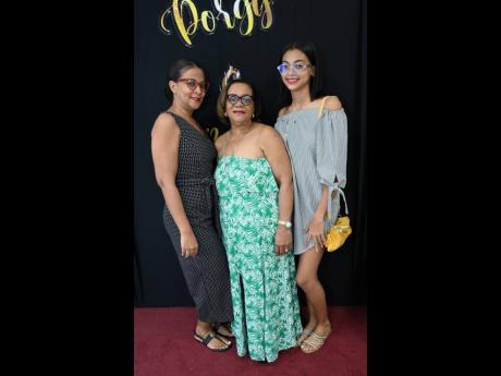 Joy Gillett-Chambers (centre), is flanked by her daughter Toni Gillett-Chambers (left) and granddaughter Leah Johnson.