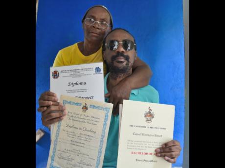 Visually impaired trained teacher Coswell Barnett is embraced by his mom, Hazelyn Small, as she shows off his academic qualifications. Brown has been struggling to find full-time employment for the past four years.