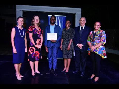 From left: Senator Kamina Johnson Smith, minister of foreign affairs and foreign trade; Judith Slater, British high commissioner to Jamaica; Najae Murray, recipient of the Chevening JN Oliver F. Clarke Scholarship; Marsha Smith, minister of state in the Mi