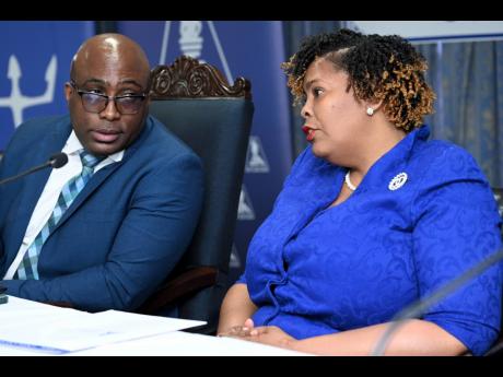 Leighton Johnson, then president of the Jamaica Teachers’ Association (JTA), speaks with the JTA’s then immediate past president, La Sonja Harrison, during the media launch of the JTA’s 60th Anniversary Celebrations earlier this year. 