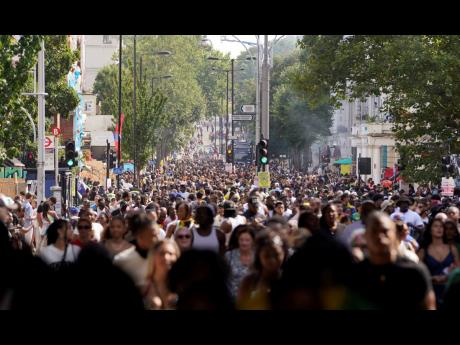 Crowds on Ladbroke Grove, London, during the Notting Hill Carnival celebration in west London, on Monday.