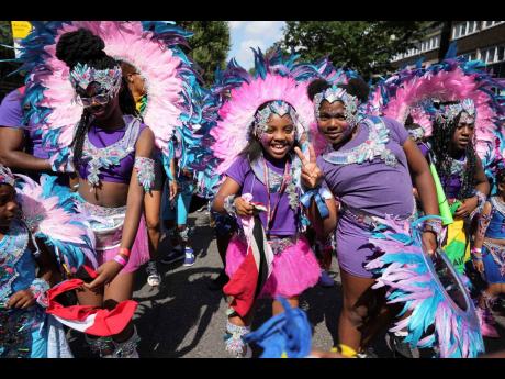 These youngsters have fun at Notting Hill Carnival’s  Children’s Day Parade on Sunday.