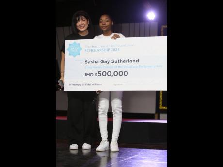 Tessanne Chin (left) surprises an emotional and teary-eyed Sasha Gay Sutherland with a scholarship on Saturday.