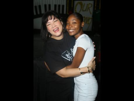 Tessanne Chin (left) congratulating Sasha Gay Sutherland after announcing that she would be giving her a scholarship. 