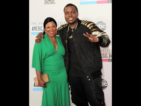 In this file photo,  Sean Kingston, right, and his mother Janice Turner arrive at the 40th anniversary American Music Awards, in November 2012, in Los Angeles. 