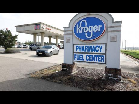 A customer exits a Kroger fuelling centre on June 26, 2019 in Flowood, Mississippi.