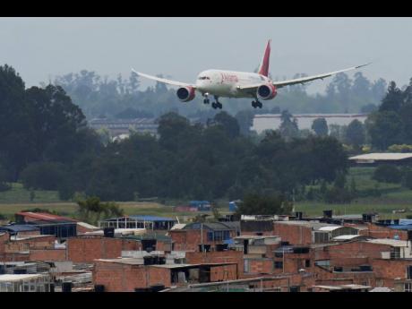 An Avianca plane approaches the runway at El Dorado airport amid jet fuel shortages in Bogota, Colombia, Monday, August 26, 2024.