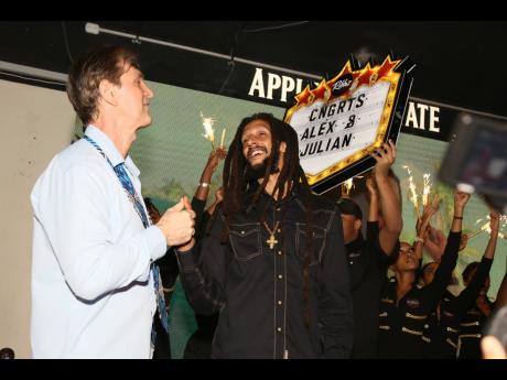 Alex Antaeus (left) and Julian Marley celebrate winning the Grammy for ‘Colors of Roya’l on Thursday February 22 at Ribbiz in St Andrew.