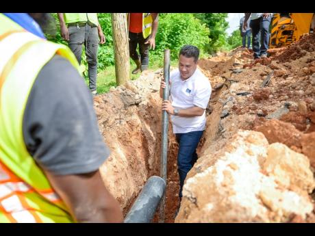 Senator Matthew Samuda, minister without portfolio in the Ministry of Economic Growth and Job Creation, at a pipeline installation site during a tour of the Mason Hall Water Supply System in St Mary last Thursday.