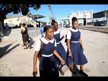 Students of Alpha High School making their way back to School at Alpha High in Kingston last year. 