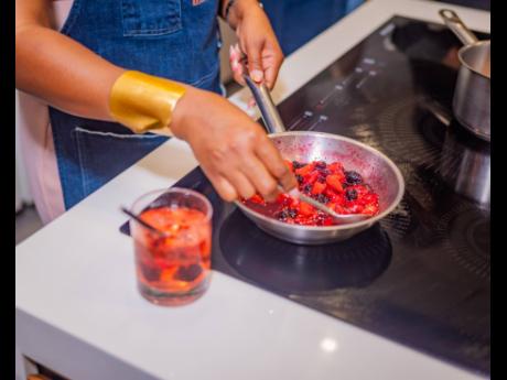 Mixed-berry pana cotta being prepared. 