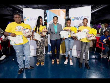 Mervelyn Harvey-Doughorty (centre), AVP & head of human resources at Massy Distribution Jamaica Limited, poses alongside students who are about to embark on the next chapter of their journey – high school. From left: Steve Plummer – heading to Jamaica 