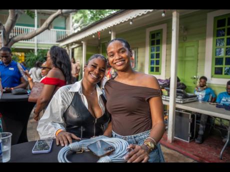 Graphic Designer Kimoi Johnson (left) and Brand Strategist Alexia James smile for the camera before the panels got under way at the Very Culture Creator Summit.