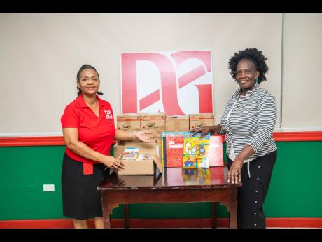 As the first day of school approaches, Callaloo Mews Basic School Principal Angella Black (right) warmly received school supplies from the D&G Foundation, presented by Foundation Administrator Totlyn Brown Robb.