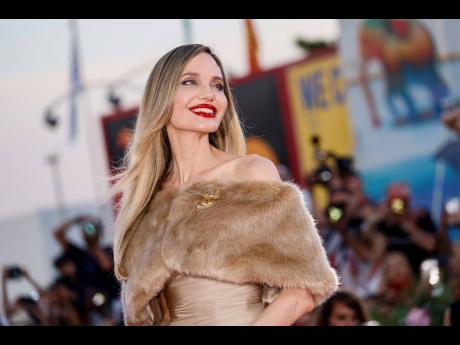 Angelina Jolie poses for the camera at the premiere of ‘Maria’, where she portrays the life of famed opera singer Maria Callas. 