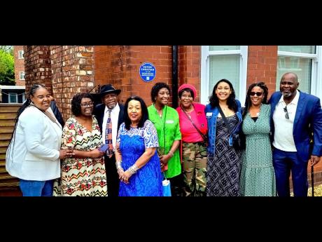 Family members and friends of Euton Christian are pictured in front of the house in Chorlton where a Blue Plaque was unveiled in honour of ex-RAF man Euton Christian.