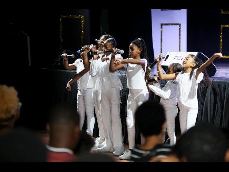 Members of the Tessanne Chin Foundation’s Summer Singing Intensive perform at ‘Voice Box Our Song’ held Saturday, August 24 in the Campion College auditorium in St Andrew.