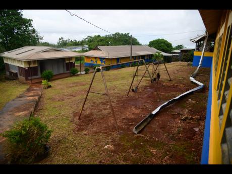 Damaged roofs and dislodged guttering at the Woodlands Primary School in Manchester last week.