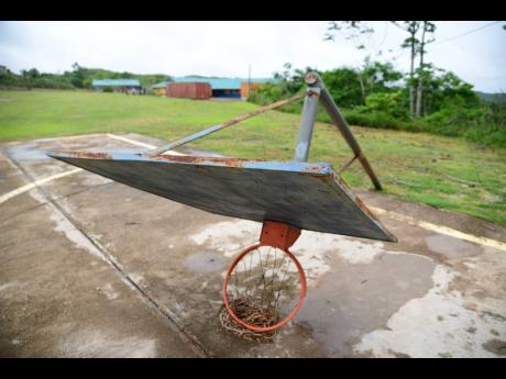 A fallen goalpost on a court at the Woodlands Primary School in Manchester.