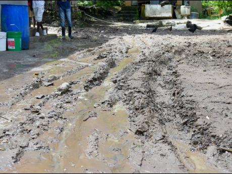 The aftermath of floodwaters caused by heavy rainfall in John’s Hall in 
St James.