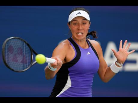 Jessica Pegula of the United States returns a shot during a match against Diana Shnaider of Russia in the fourth round of the US Open Tennis Championships in New York yesterday.