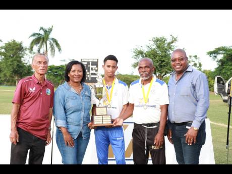 Captain of the Westmoreland Under-15 cricket team Ryan Littleton (centre) poses with the Kingston Wharves trophy at the recent presentation. Also in photograph are (from left) Jamaica Cricket Association (JCA) President Dr Donovan Bennett; Simone Murdock, 