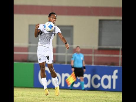 Adrian Reid Jr of Cavalier in action against Police FC of Trinidad and Tobago during a Concacaf Caribbean Cup match at Sabina Park on August 30.