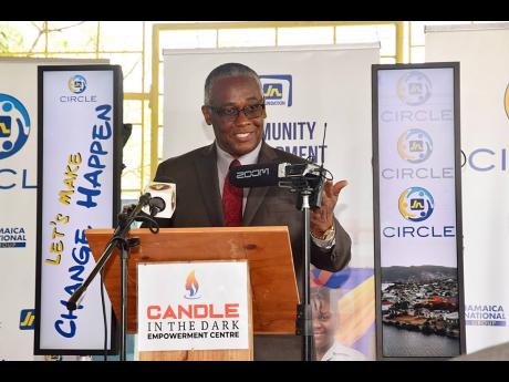 Lt Col Garfield Green, custos of Manchester, delivers remarks at the handover ceremony for the solar energy system to Candle in the Dark on August 28.