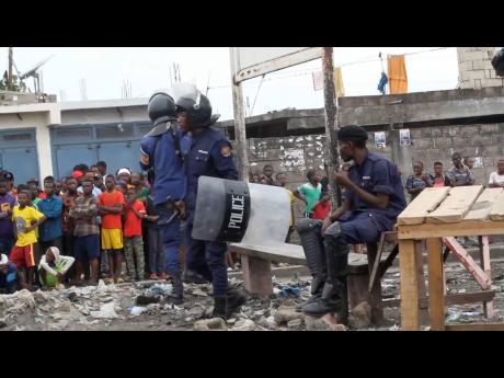 Police officers outside Makala prison in Kinshasa, Democratic Republic of the Congo, following an attempted jailbreak at Congo’s main prison on Monday.