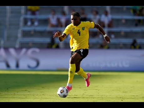 Jamaica defender Amarii Bell moves the ball against Guadeloupe during the first half of a CONCACAF Gold Cup Group C football match, Friday, July 16, 2021, in Orlando, Florida.