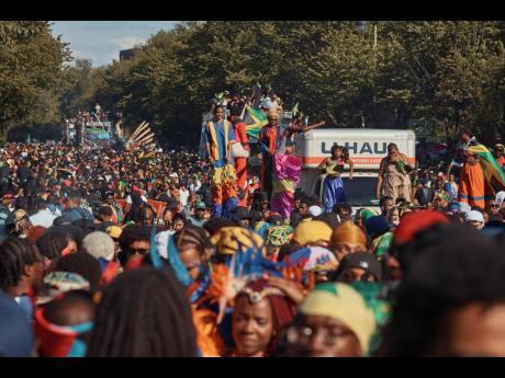 Revellers march at the intersection of Franklin Avenue and Eastern Parkway during the West Indian Day Parade on Monday.