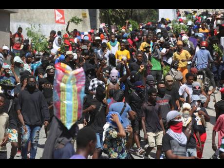 People protest for the police and prime minister to take immediate action against gangs in Port-au-Prince, Haiti, on August 19.