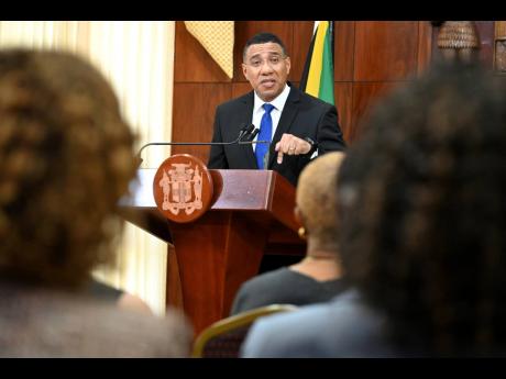 Prime Minister Andrew Holness announces a by-election for St Ann North East during yesterday’s post-Cabinet press briefing at Jamaica House in 
St Andrew. 