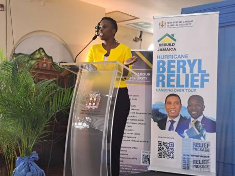 Remi Rodney, a resident of Mt Salem, St James, delivers the vote of thanks on behalf of residents from St James and Hanover who were beneficiaries of the Ministry of Labour and Social Security's Rebuild Jamaica Programme, at the Montego Bay Cultural Centre