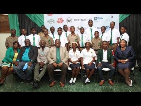 In this file photo, the Calabar Alumni and Friends Association UK’s scholarship cohort poses for a photo with (from left, seated) Calabar High School Vice-Principal Sian-Mahay Wilson, Major Evrol Dixon, Dave Thomas, Vice-Principal Calvin Rowe, scholarshi