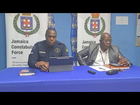 Acting Senior Superintendent in charge of St Catherine North, Hopeton Nicholson (left), and DSP Collin McKenzie. 