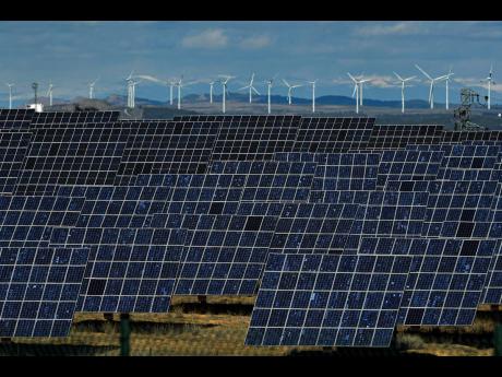 Solar panels work near the small town of Milagro, Navarra Province, northern Spain.