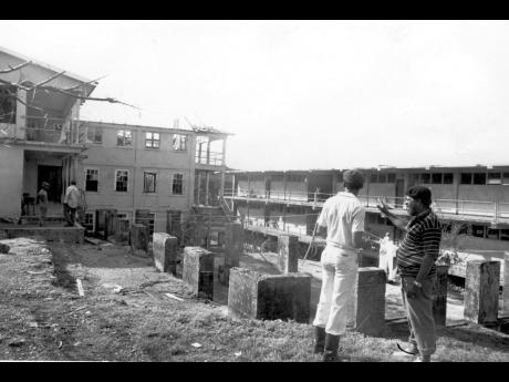 September 1988: It is very unlikely that the Happy Grove High School at Hector’s River in Portland will be reopened soon. The 90-year-old institution looks like an atomic bomb had been dropped on to it. Principal Lorreston Lindsay (right) is not very opt