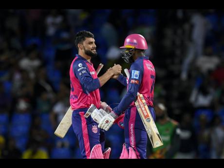 
Naveen ul Haq (left) and Nyeem Young of Barbados Royals celebrate winning a men’s 2024 Republic Bank Caribbean Premier League against St Kitts and Nevis Patriots at Warner Park Sporting Complex on Friday night.