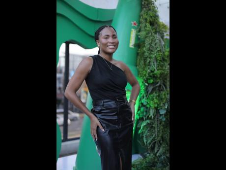 Turning heads in a sleek all-black ensemble is the beautiful Jhoni Wright.