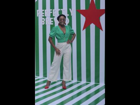 The day’s host, Brithney Clarke, paused to capture the moment under the iconic Heineken star.