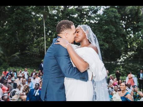 The newly-weds sealed the deal, sharing a first kiss as husband and wife.