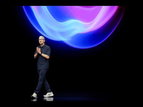 Apple CEO Tim Cook talks on the stage during an announcement of new products at Apple’s headquarters on Monday, September 9, 2024, in Cupertino, California.