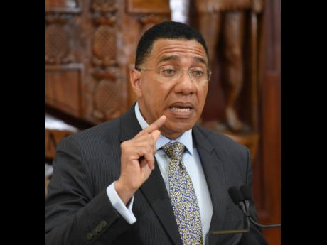 Prime Minister Andrew Holness makes a point during a post-Cabinet press briefing at Jamaica House in St Andrew on Tuesday.