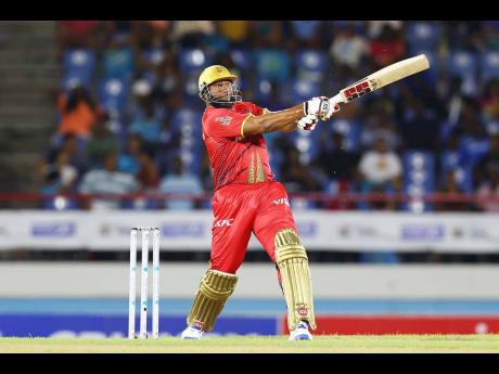 Kieron Pollard of Trinbago Knight Riders swings for the fencing during an innings of 52* against the St Lucia Kings in the Men’s 2024 Republic Bank Caribbean Premier League at Daren Sammy National Cricket Stadium on Tuesday night.