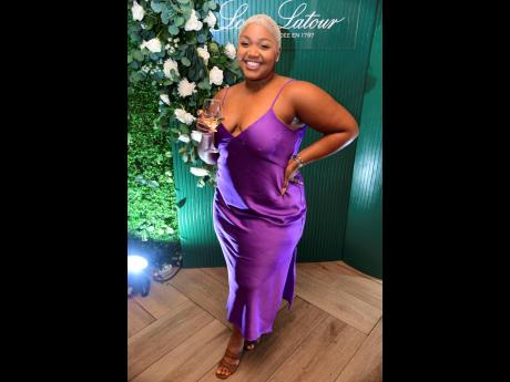 Thais-Alexis Morrison is bringing back ‘90s effortless glamour in this purple slip dress. 