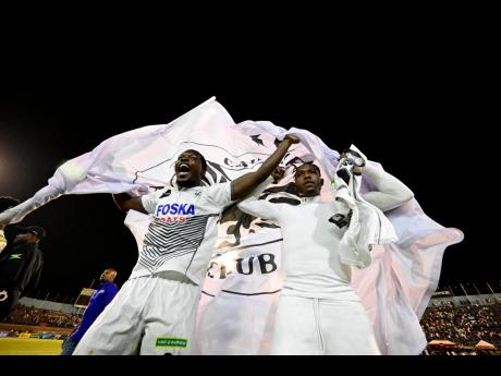 Cavalier players celebrate winning the 2023-24 Wray and Nephew Jamaica Premier League.